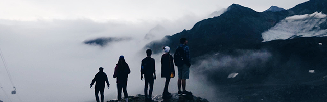 student looking out over mountains